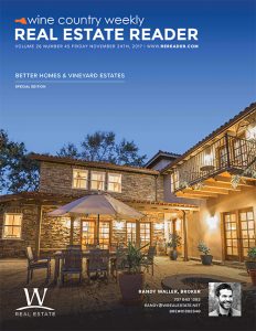 magazine cover showcasing modern stacked stone home at night with accompanying outdoor patio set