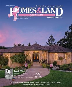 magazine cover of large modern tuscan style home at dusk